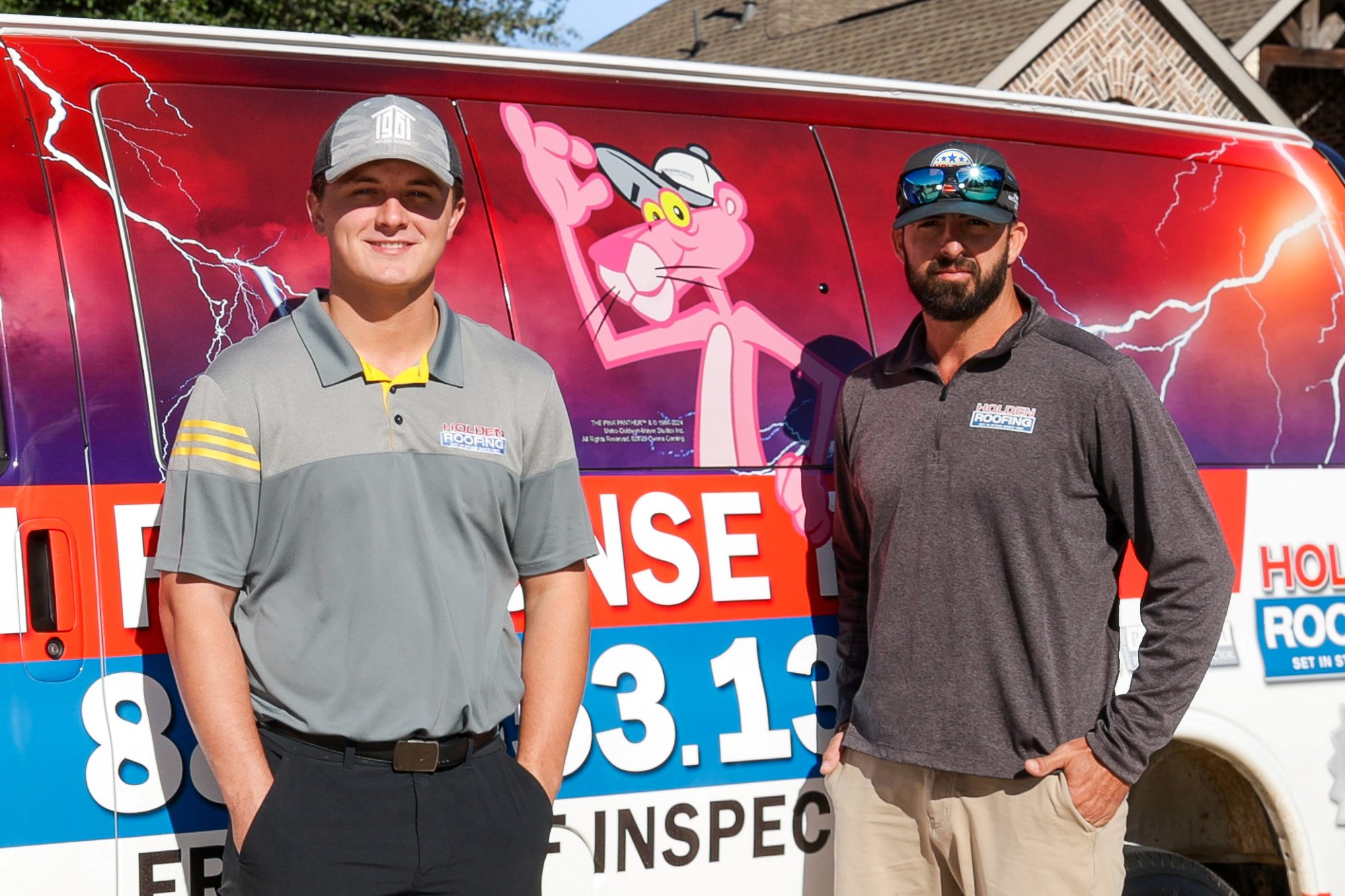 Two Holden Roofing project managers beside the company van