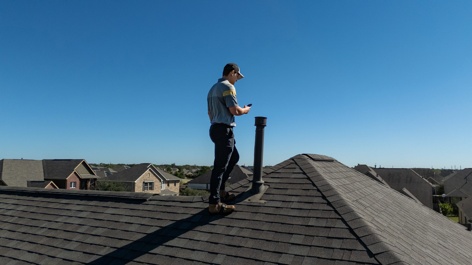 roof inspection Austin TX, Holden Roofing Austin project manager reviewing free roof inspection photos with a Pflugerville homeowner, serving Austin, Pflugerville, Round Rock and Hutto for roof inspection, roof repair and storm damage claims