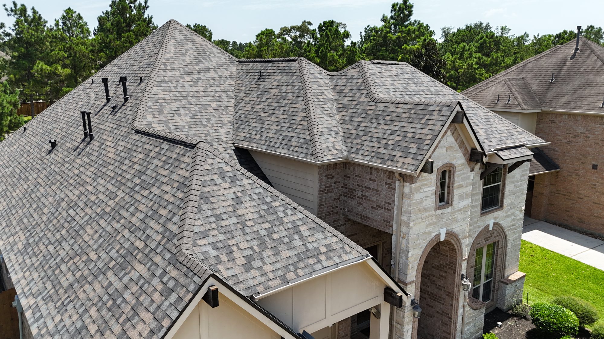 Architectural shingle roof and ridge vents, aerial