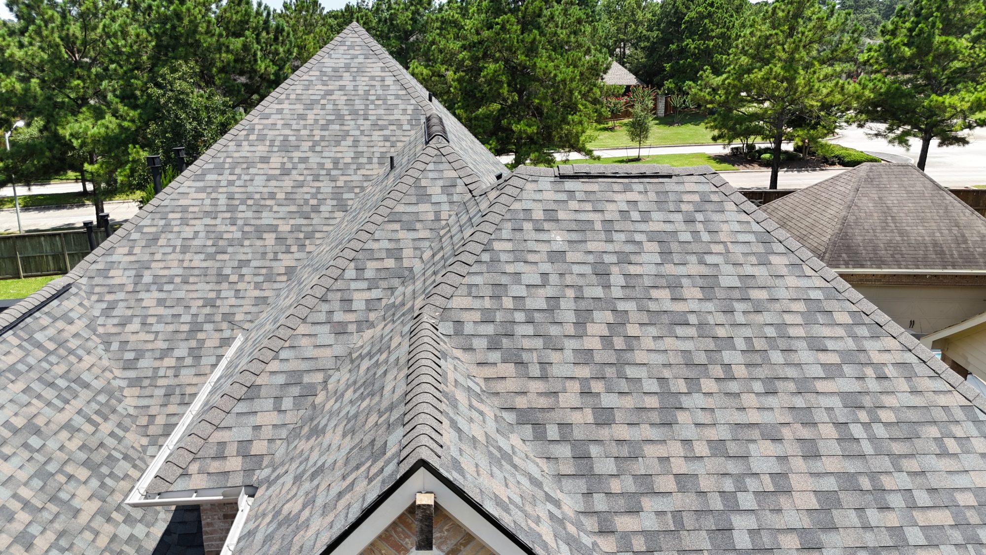 Architectural shingle valleys and ridge, aerial close
