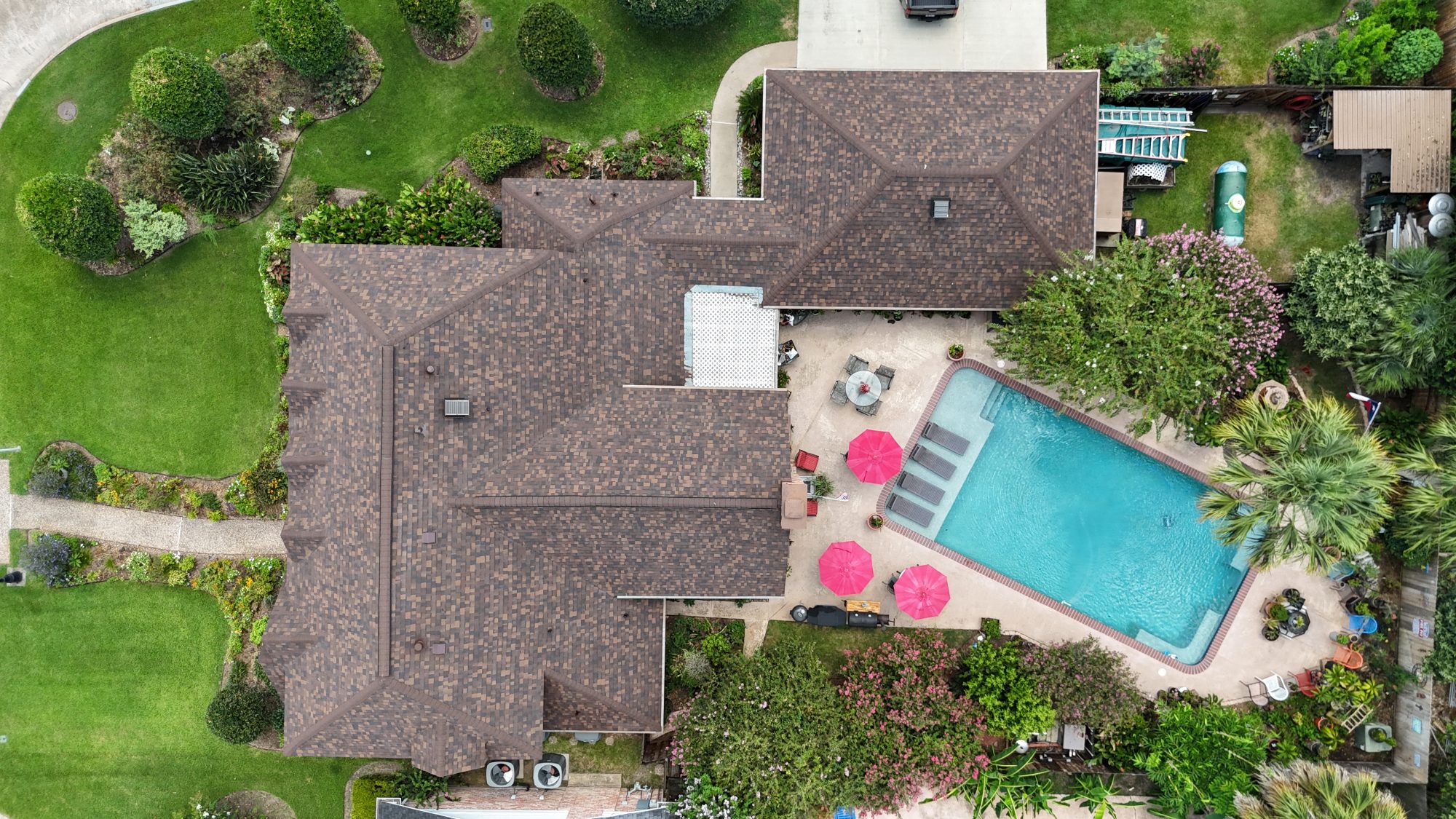 Shingle roof and backyard pool, straight-down aerial