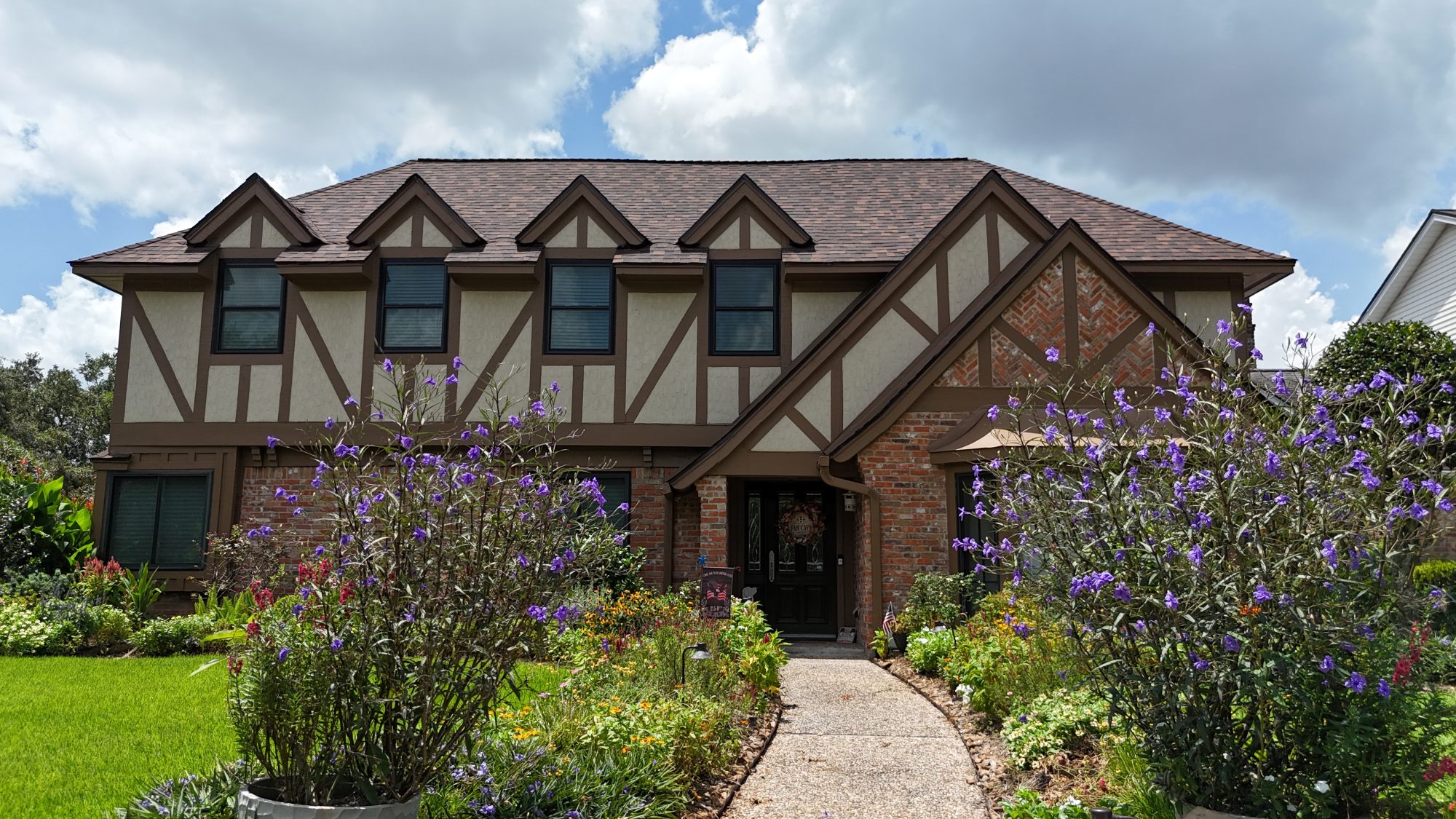 Two-story home with a new architectural shingle roof, front view