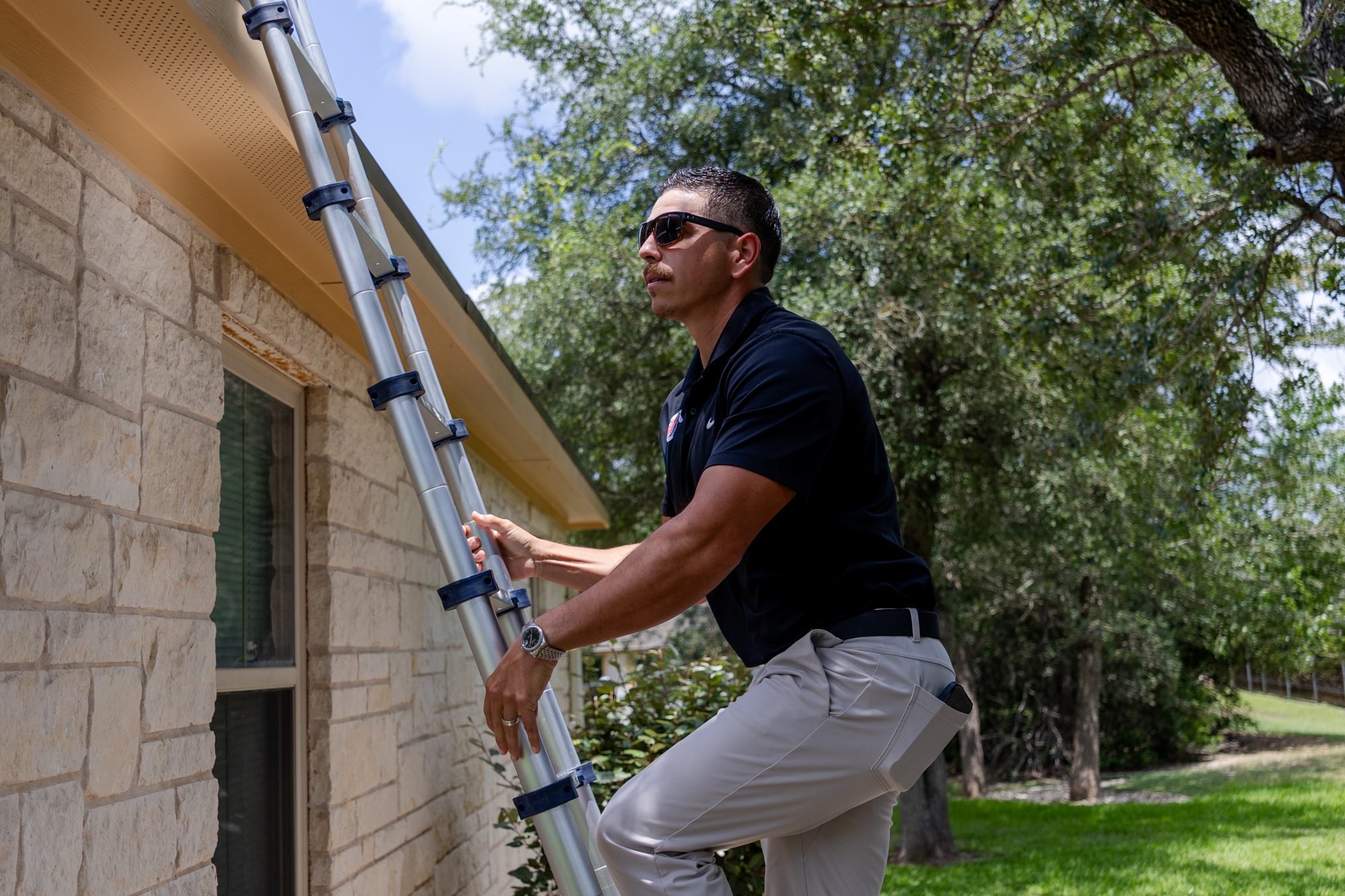 A Holden project manager setting a ladder for an inspection