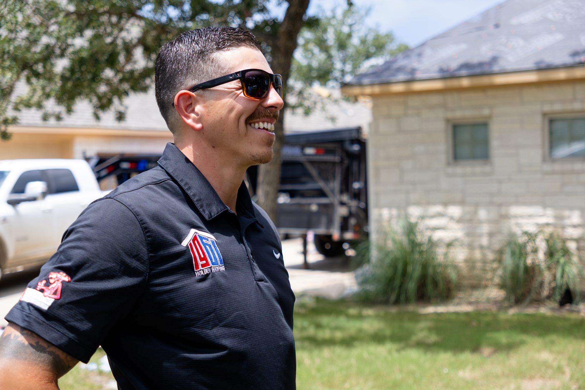 A Holden project manager on site with the crew trailer behind