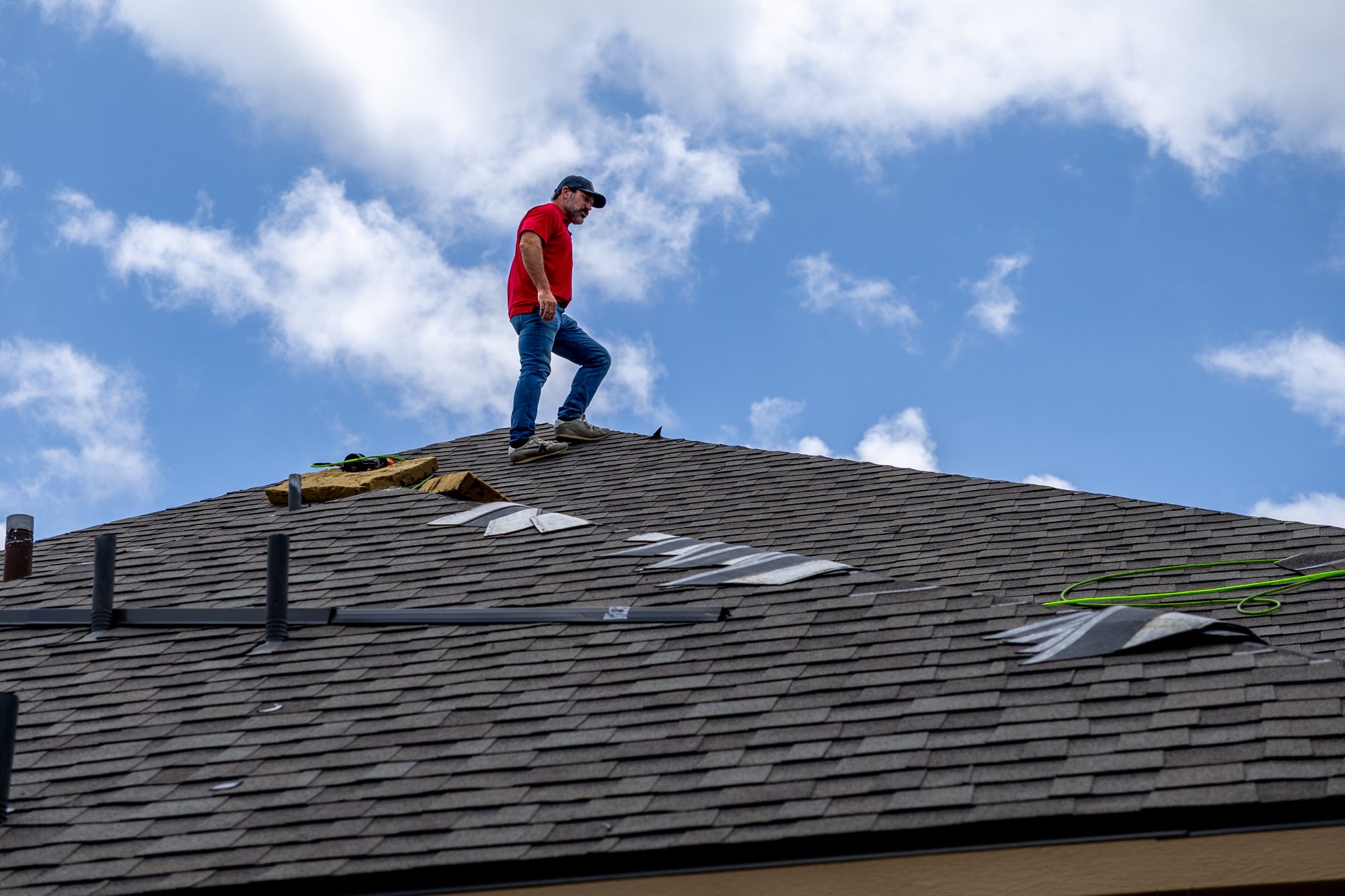 roof replacement Austin TX, Holden Roofing Austin crew running a magnetic nail sweep after a one-day roof replacement in Round Rock, roof replacement, roof repair and roof inspection serving Round Rock, Austin, Georgetown and Leander