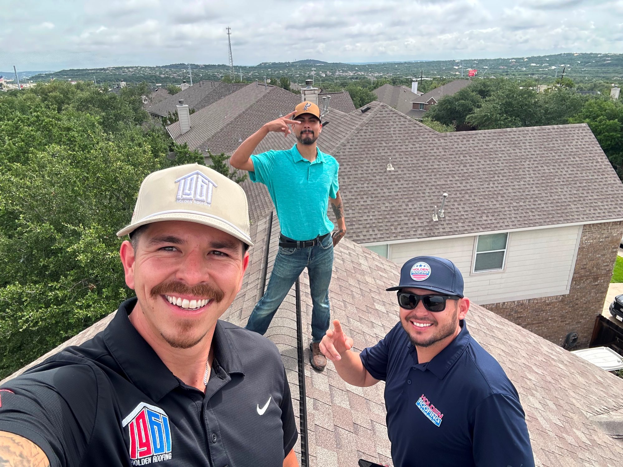 Holden project managers on a roof in Central Texas