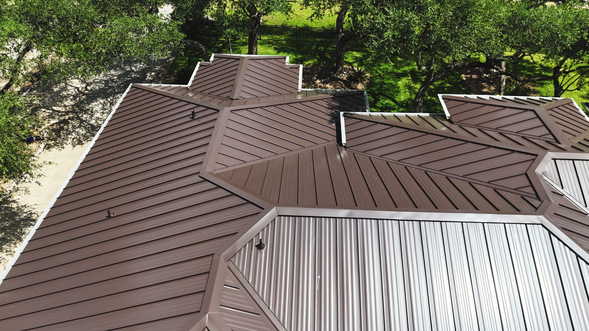 Brown standing seam metal roof, aerial close