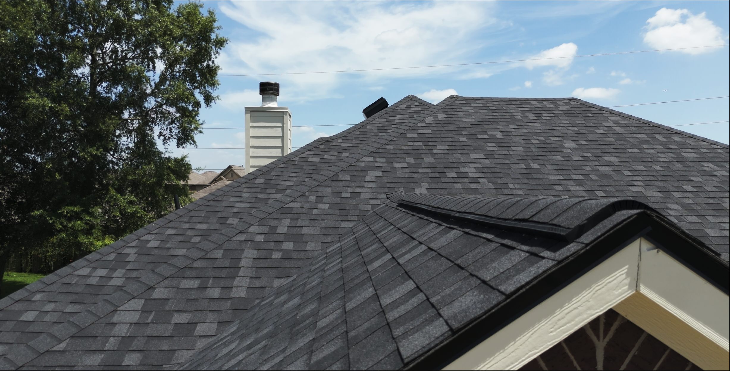 Black architectural shingle roof, aerial close