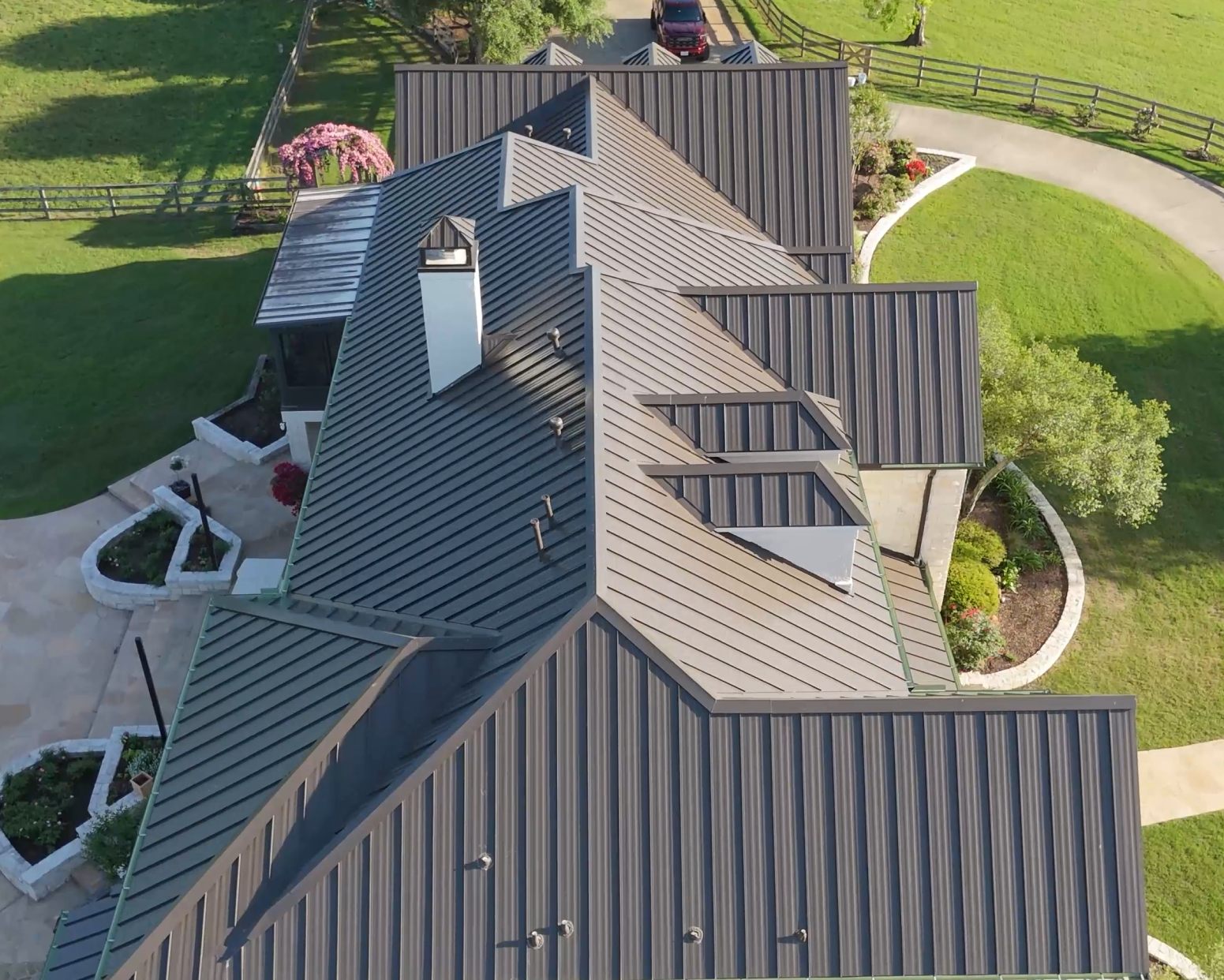 Dark standing seam metal roof, aerial
