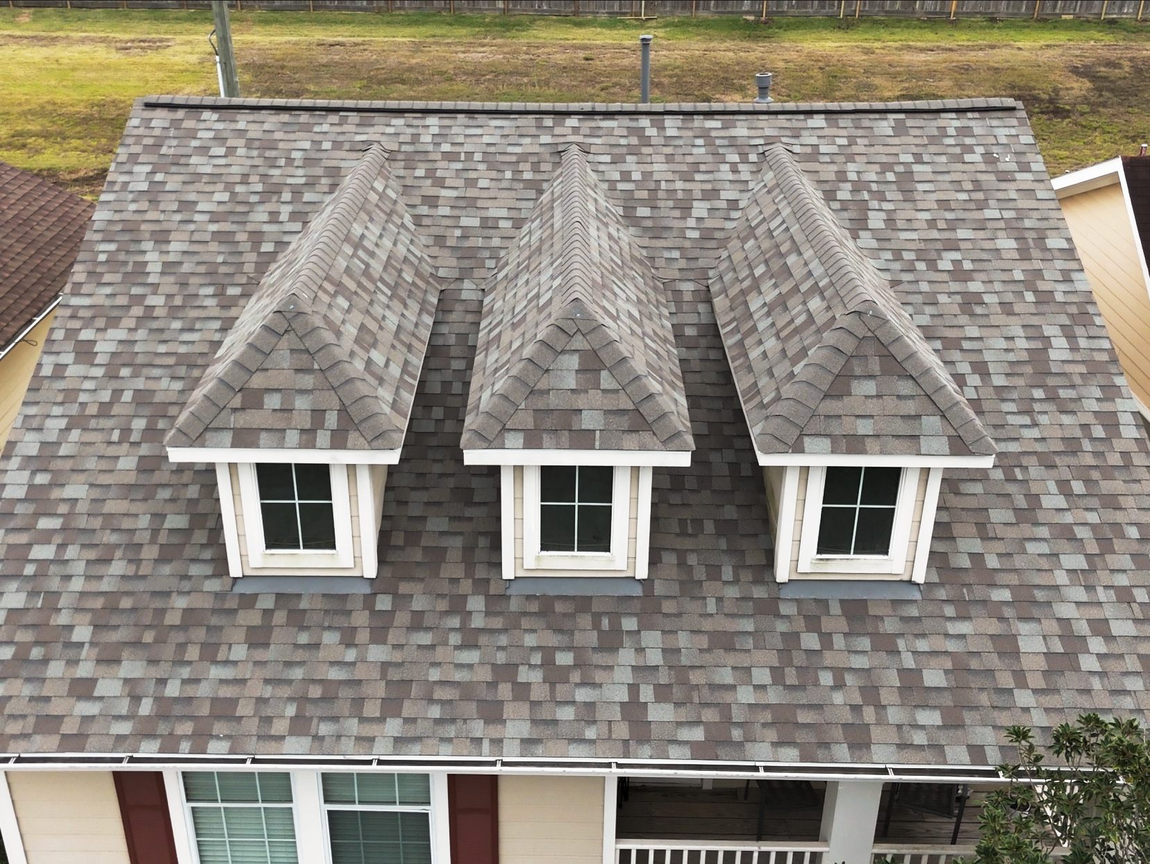 Architectural shingle roof with three dormers