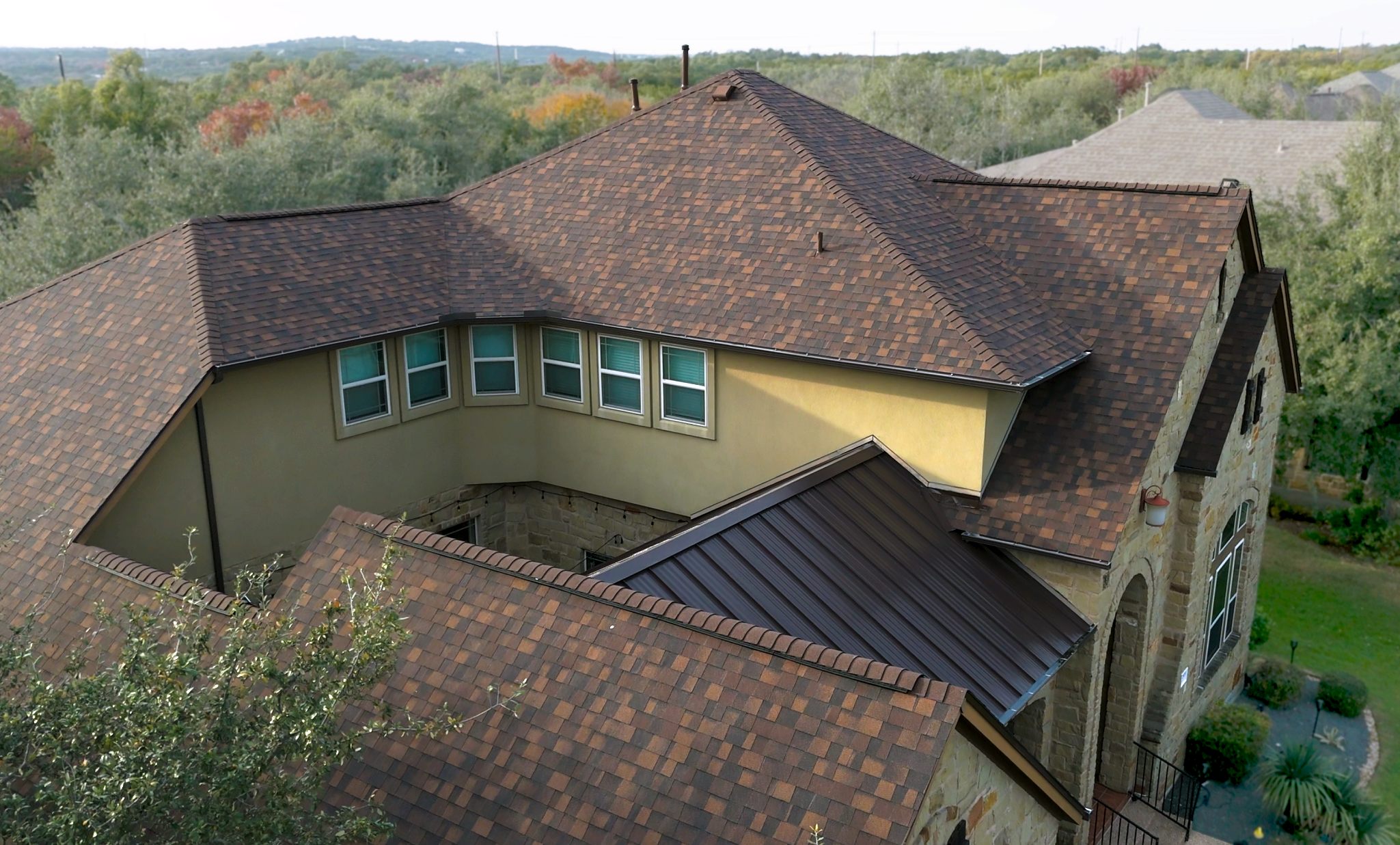 Concrete tile roof with standing seam accents, aerial