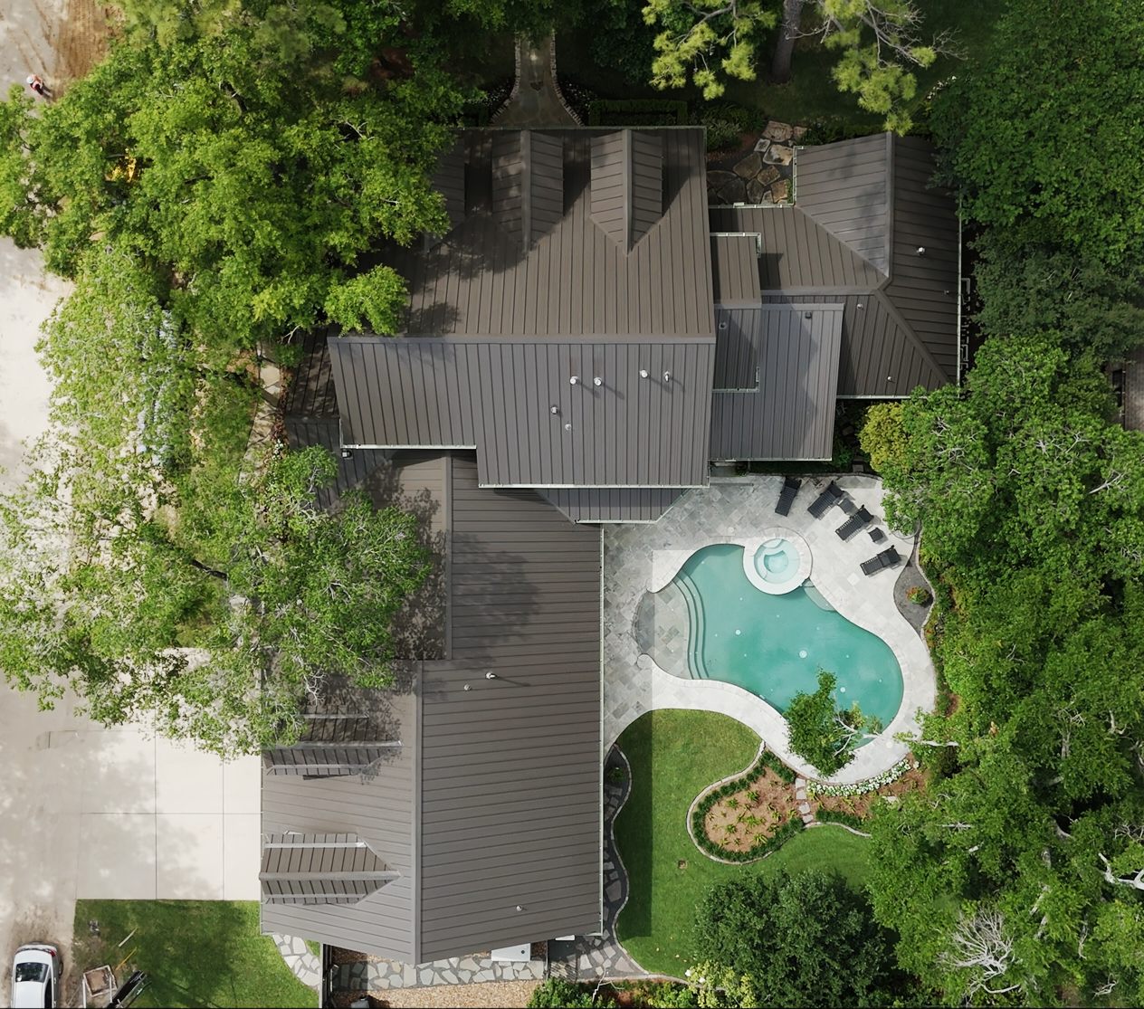 roofing contractor Del Valle TX, Holden Roofing Austin standing seam metal roof replacement on an Elroy acreage home near Circuit of the Americas, metal roofing and shingle roof replacement serving Del Valle, Buda, Kyle and Manor
