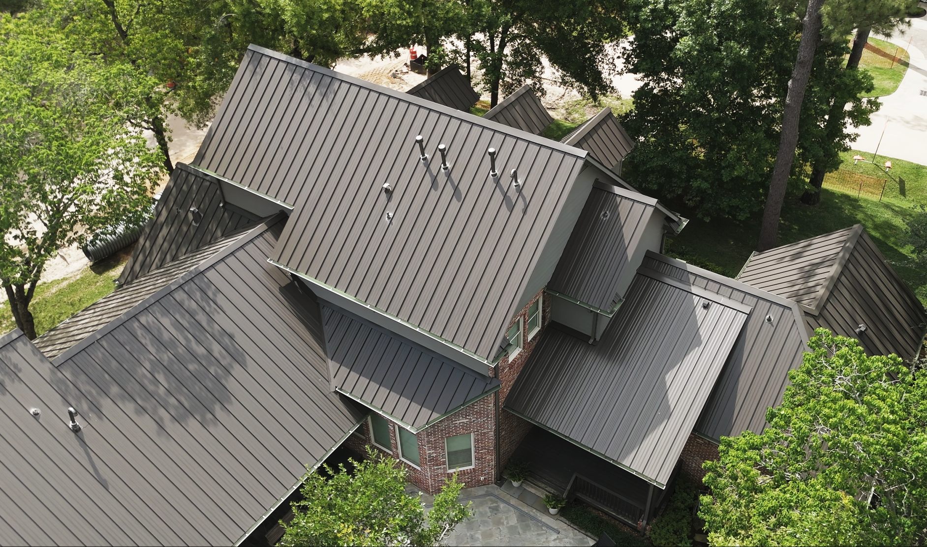 Grey standing seam metal roof, aerial