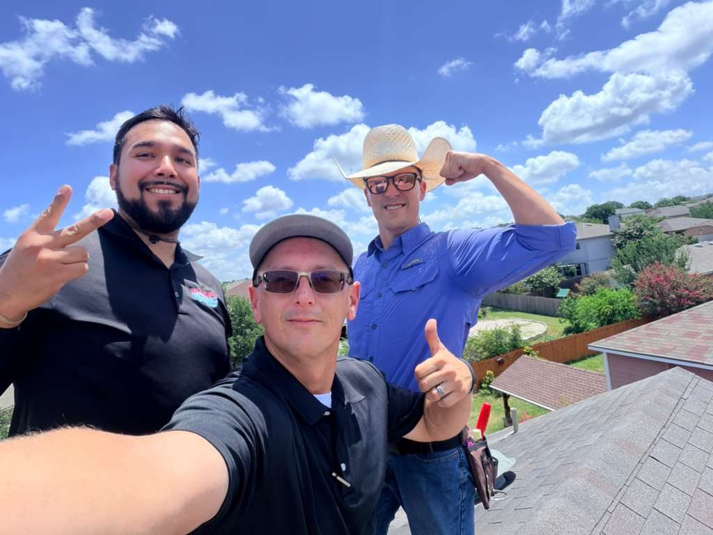 Holden team members on a roof