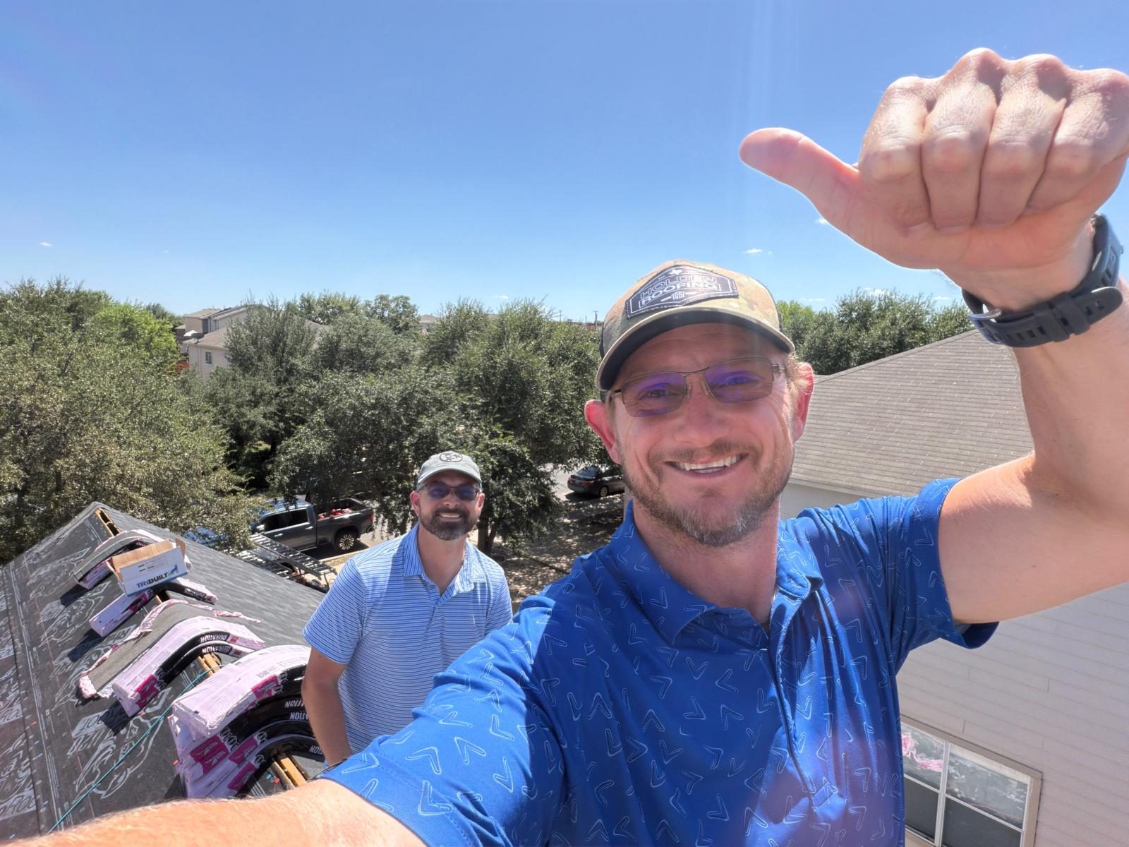 Holden team members on a roof